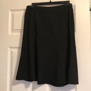Gently flared/paneled skirt.